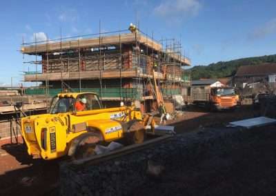 Construction of Talocher School in Monmouth with JCB telehandler and truck