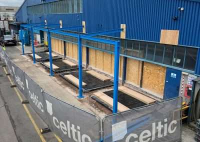 Enersys Cell 2 extension construction site with blue metal framework and fencing.