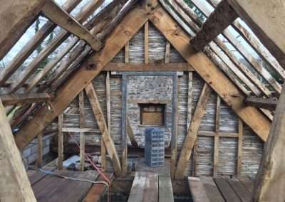 Interior view of a rustic wooden barn or Corn Exchange structure under construction