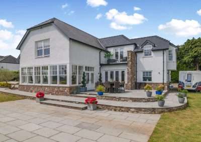 Avarla exterior, a large modern house in a rural setting,